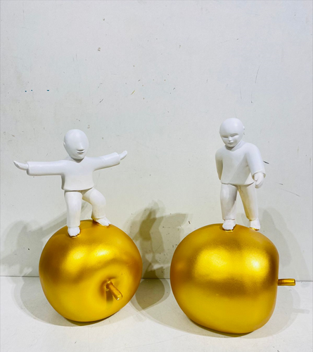 Men Standing on Big Apple Golden Colour Home Decor Artefact. (set)