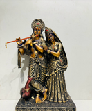 Elegant Maroon Lord Radha Krishna Idol with Gold Accents