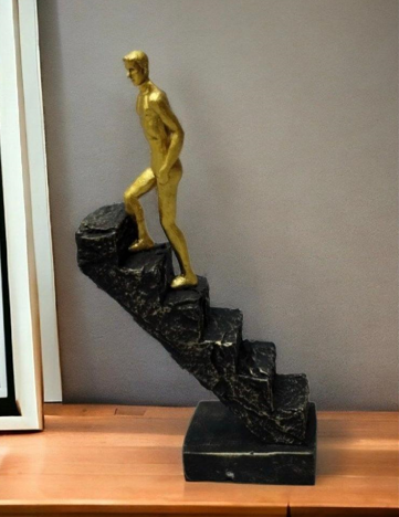 Man Climbing Staircase Artefact