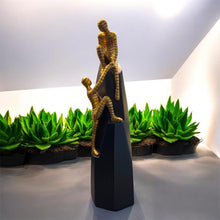 Load image into Gallery viewer, Human Assisting Another in Climbing Decorative Artefact
