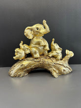 Load image into Gallery viewer, Golden Colour Elephant Artefact Seated on Wood with Two Baby Elephants