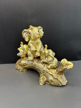 Load image into Gallery viewer, Golden Colour Elephant Artefact Seated on Wood with Two Baby Elephants