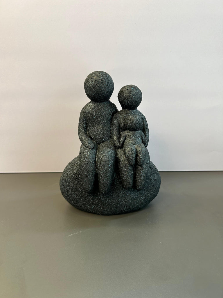 Family Seated on a Rock Artefact For Home and Office Decor