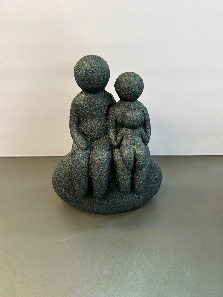 Family Seated on a Rock Artefact For Home and Office Decor