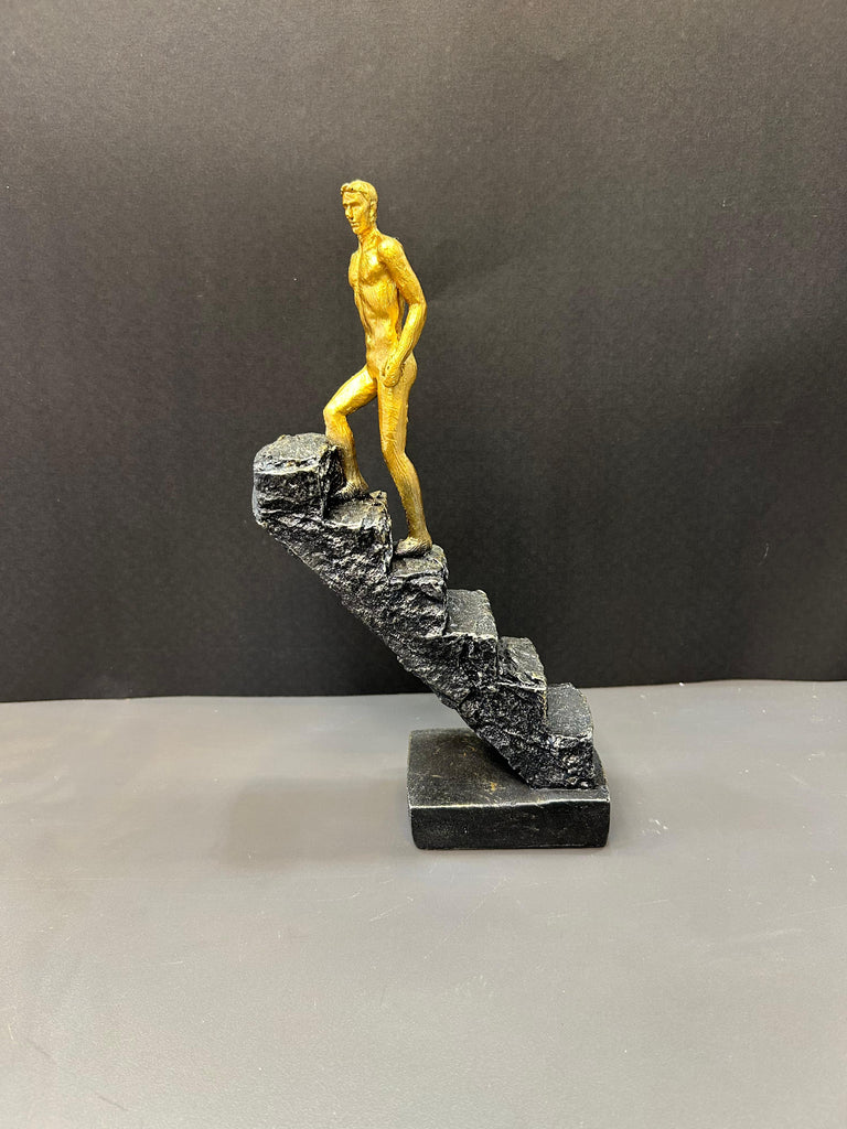 Man Climbing Staircase Artefact